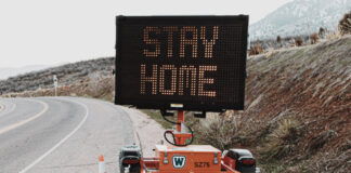 Road-side sign encouraging people to stay home during the coronavirus pandemic. Photo by LOGAN WEAVER on Unsplash.