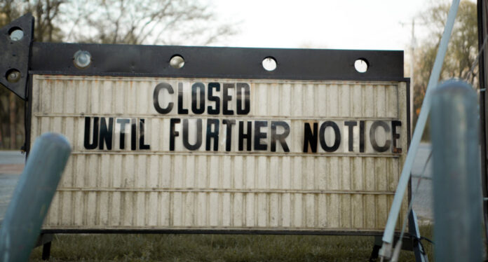 sign saying closed until further notices