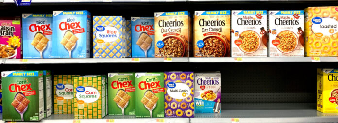 cereal boxes at a grocery store. Photo by Franki Chamaki on Unsplash