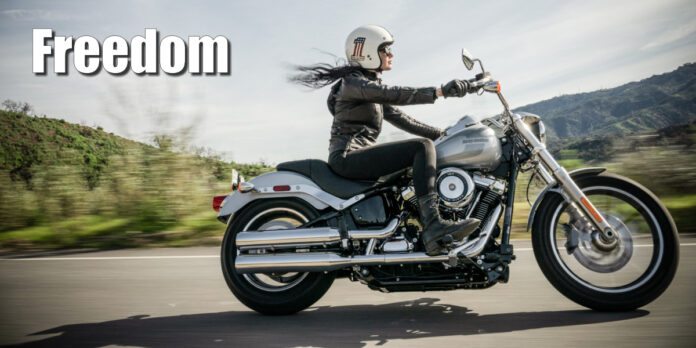 Woman riding a Harley-Davidson