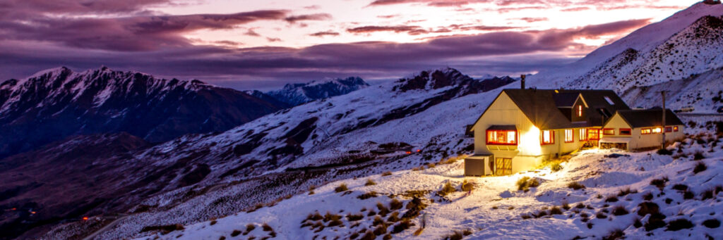 Home in snow covered mountains