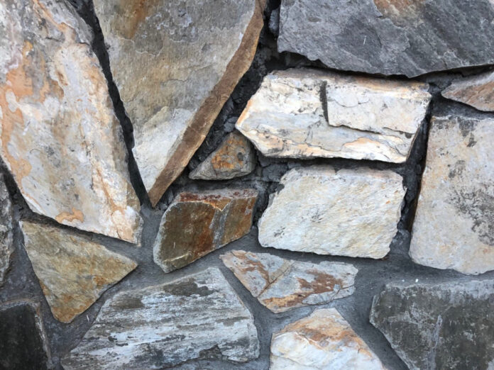 Rock wall with missing grout.