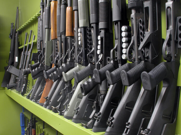 A row of shotguns in a store