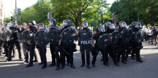 Riot police in Washington, DC. Photo by Ryan Kosmides on Unsplash.