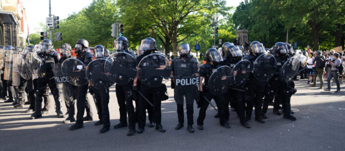Riot police in Washington, DC. Photo by Ryan Kosmides on Unsplash.