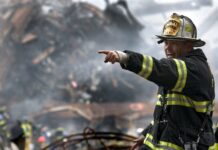 Fireman amid the rubble on 9/11. Photo by David Mark from Pixabay,