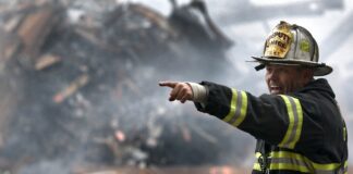 Fireman amid the rubble on 9/11. Photo by David Mark from Pixabay,