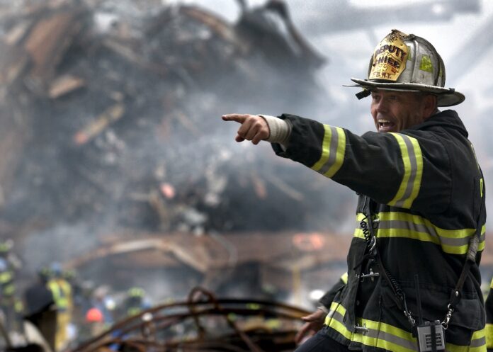 Fireman amid the rubble on 9/11. Photo by David Mark from Pixabay,