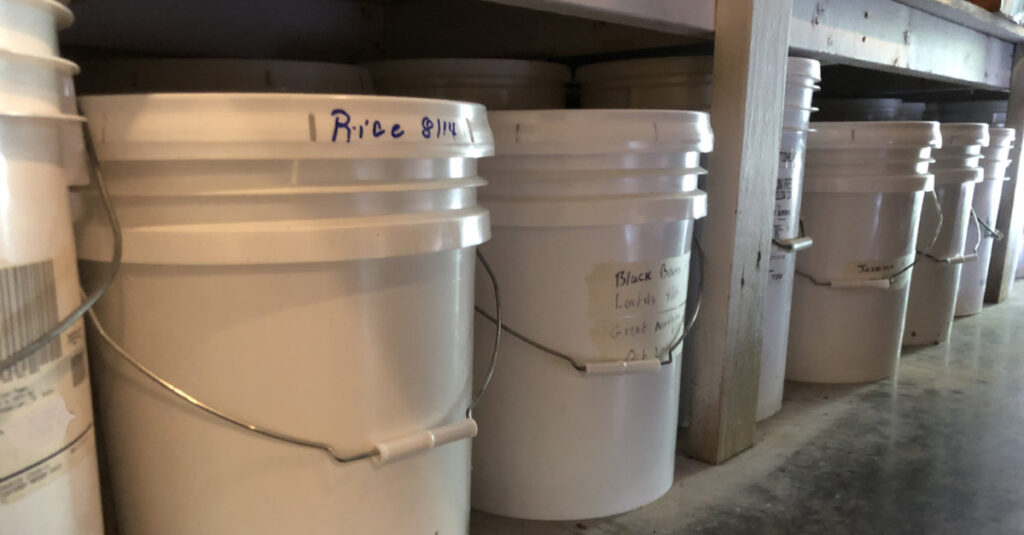 5 and 6-gallon pails of rice and beans