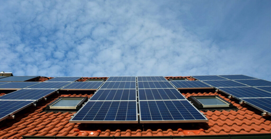 solar panels on a roof. Photo by Ulrike Leone from Pixabay.