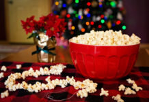 Popcorn in a bowl with a Christmas tree in the background. Photo by Jill Wellington from Pixabay.