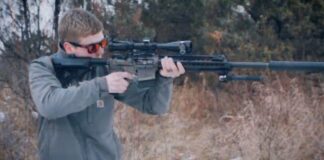 Rifle with Banish 30 multi-caliber suppressor
