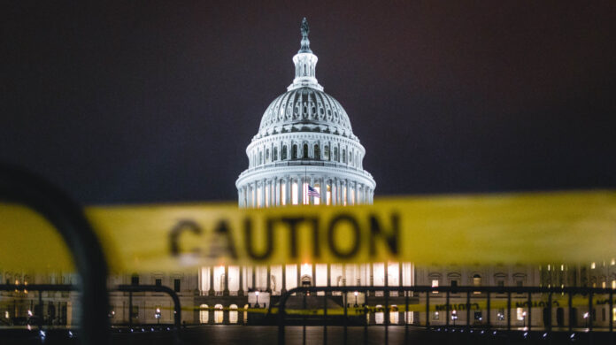 Caution tape at the U.S. Capitol. Photo by Andy Feliciotti on Unsplash/