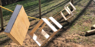 Beehive equipment strung up to be painted.