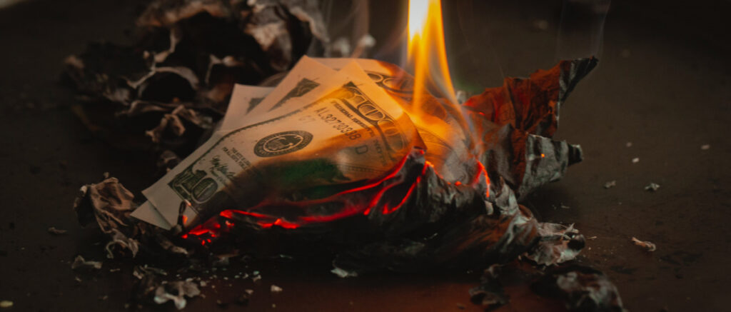 burning cash.  Photo by Jp Valery on Unsplash