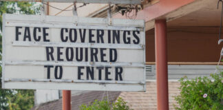 Sign stating face coverings required to enter