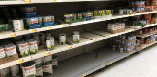 A partially empty shelf at Walmart