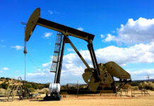 Pumping oil from the ground, Image by John R Perry from Pixabay.