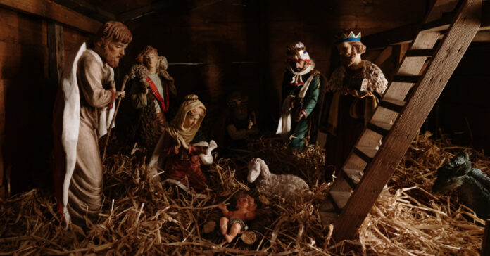 A Christmas nativity scene, Photo by Al Elmes on Unsplash.
