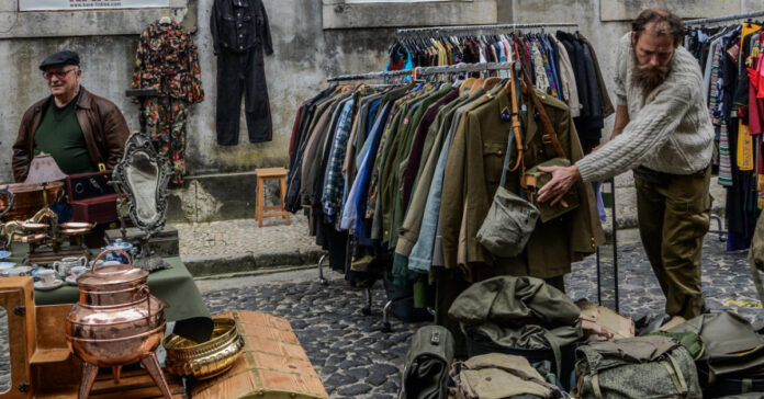 Used merchandise at a flea market. Photo by Alice Pasqual on Unsplash.