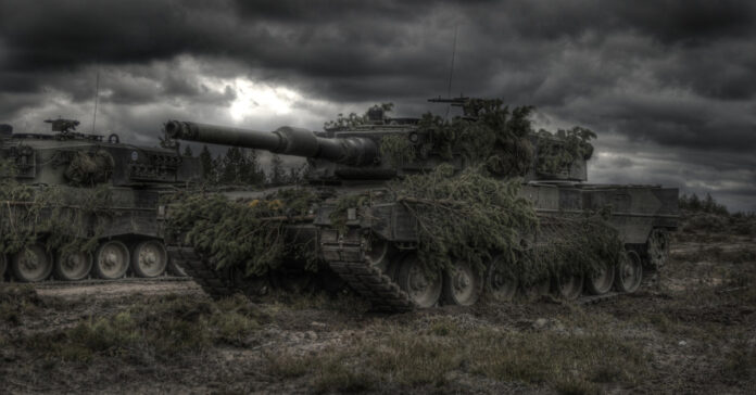Two tanks under a cloudy sky