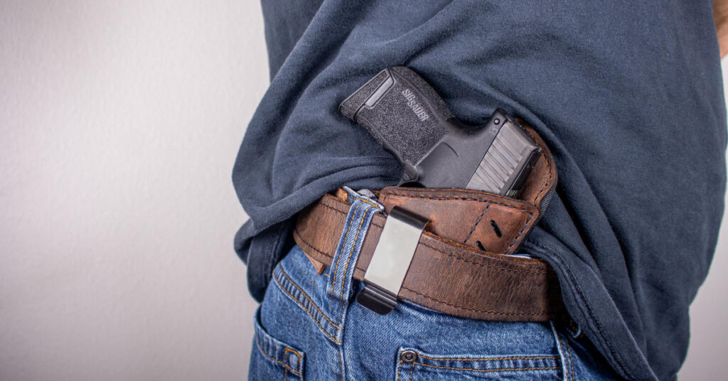 You can see how this inside-the-waistband holster and gun could be easily concealed by draping the shirt over it..