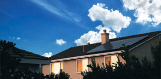 A house with solar panels on its roof.