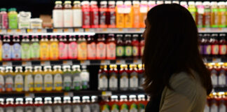 A woman grocery shopping.