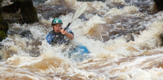 A kayaker in rough water