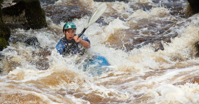 A kayaker in rough water