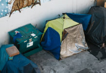 homeless tents on a city street,
