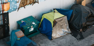 homeless tents on a city street,