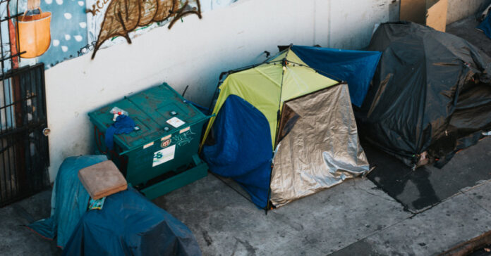 homeless tents on a city street,
