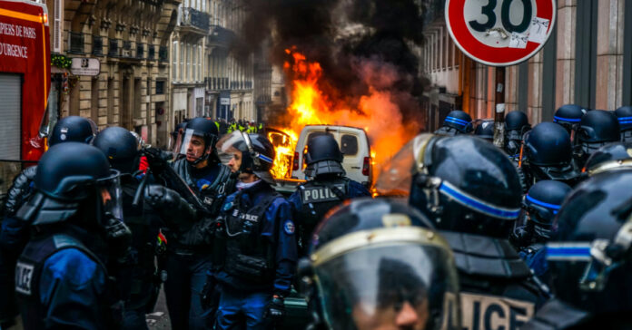 Rioters burn a van in France