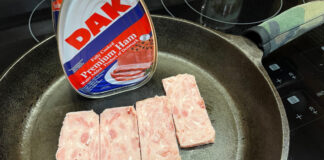 Slices of canned ham in the frying pan.