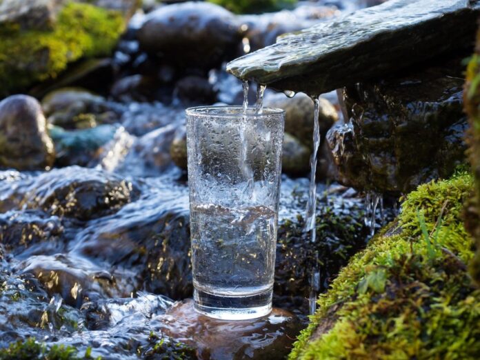 A waterfall filling a drinking glass
