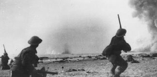 Soldiers from the British Expeditionary Force fire at low flying German aircraft during the Dunkirk evacuation in June of 1940.