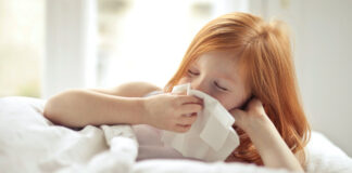 A child in bed with a cold