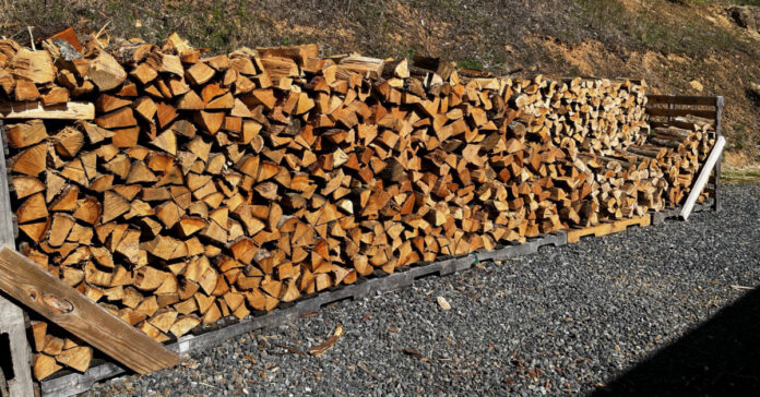 A double-row of firewood on five pallets. This represnets about 40 percent of the firewood we have on hand for the coming winter.