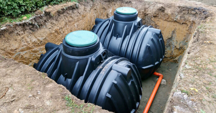 An example of septic tanks installed and waiting to be buried. The green lids should be at or near grade level to facilitate inspection, pumping and maintenance.