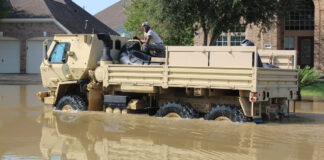 A military vehicle patrols neighborhoods around Houston looking for flood victims who need to be rescued after Hurricane Harvey struck in 2017.