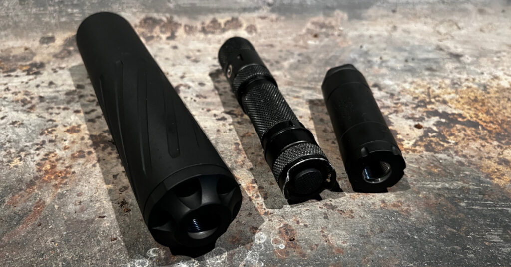 From left to right: Banish .223 suppressor, Powertac E5 flashlight, Banish 22K Vs suppressor.  The tiny suppressor is surprisingly effective.