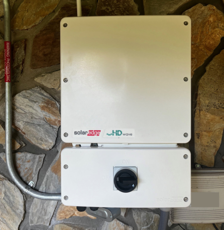 The inverter converts DC from the panels to AC for the house and to sell back to the grid.