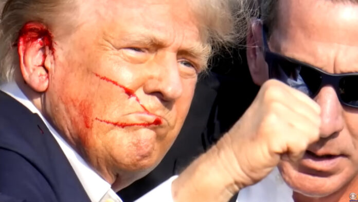 Former President Donald Trump moments after he was shot in an attempted assassination.