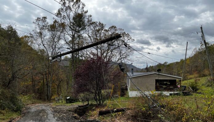 The power lines are a mess after Hurricane Helene. This pole snapped while the ones to the left are off-kilter.