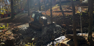 The DOT took a quick and dirty approach to repairing our ford -- just fill it in with rocks. At least we are able to get across it.