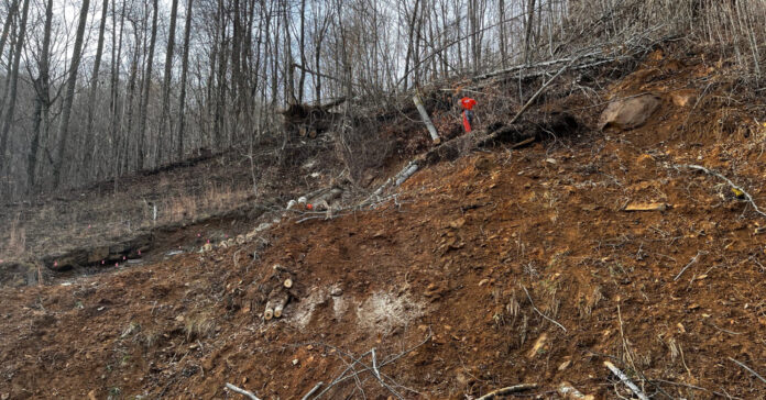 Seeing the fellow at the top of the landslide in Samaritan's Purse orange T-shirt helps put into perspective how large our landslide is.