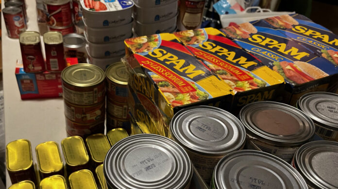 I stacked and sorted our canned foods as part of the inventory process.