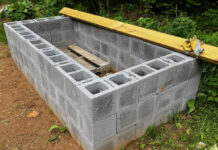 When covered with a lockable lid or roof, this enclosure will be the bunker where we store our gasoline cans, spare kerosene, and pesticides we don't want in the house.