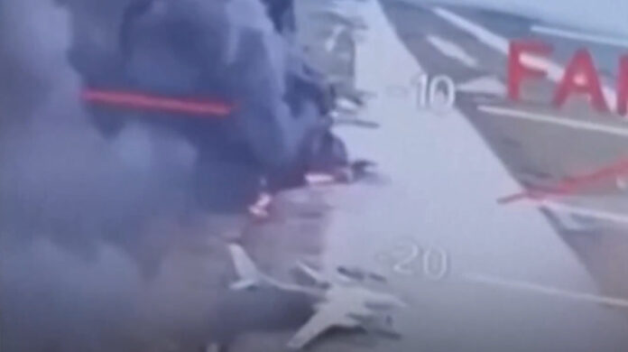 Footage from a video showing burning bombers at a Russian airbase after a Ukrainian drone attack.